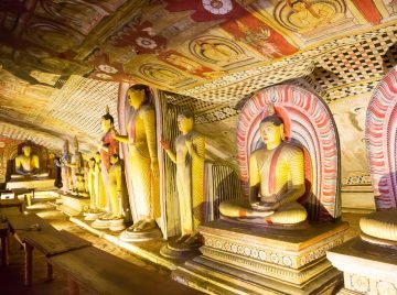Ancient golden statues in buddha temple on Ceylon