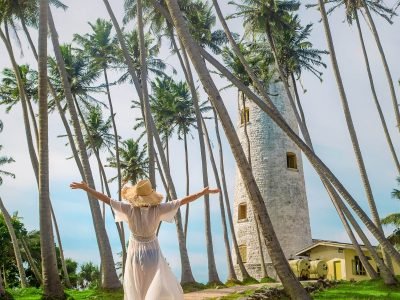 girl-in-sri-lanka-on-an-island-with-a-lighthouse-2023-11-27-04-55-10-utc
